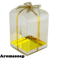 Plastic box with gold bow and gold bottom